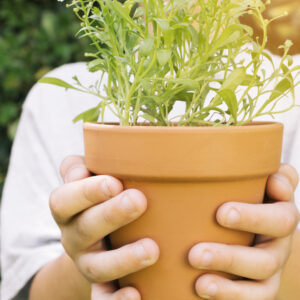 crop kid with flowerpot