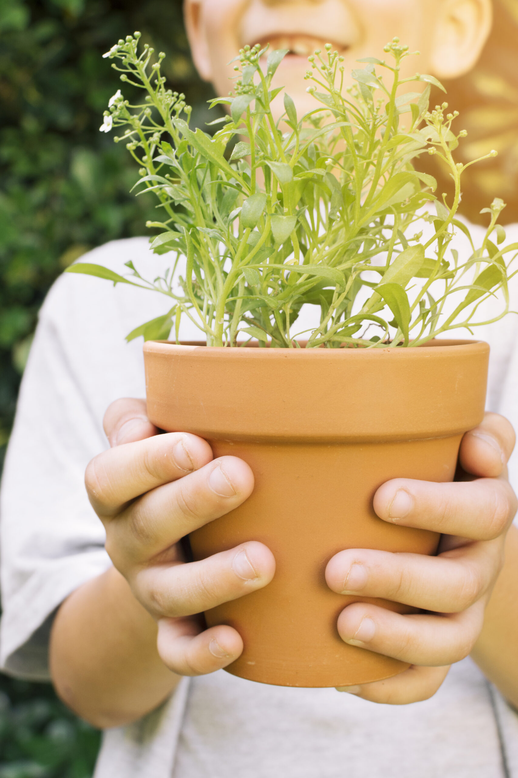 crop kid with flowerpot